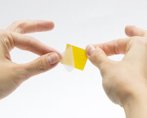 How do I remove the liner on a double-sided tape?